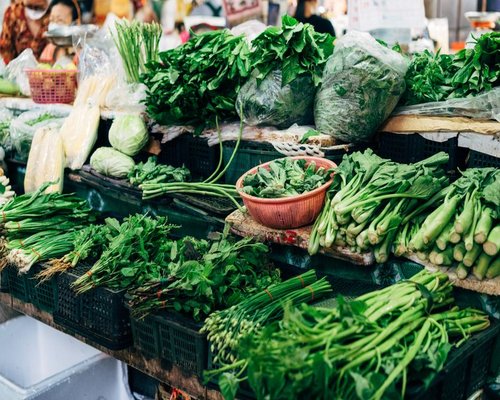 Assorted fresh dark green leafy vegetables from a local community market