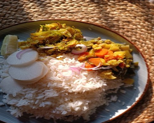 Healthy balanced Thai meal with rice, fresh vegetables and fish representing everyday lifestyle nutrition